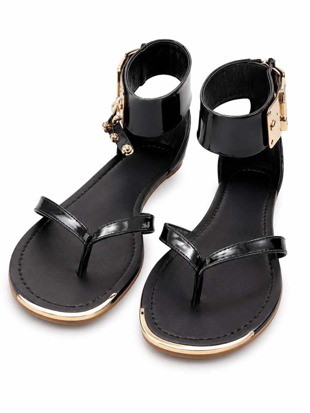 Vince Camuto thong style featuring a patent leather upper and a wide ankle cuff